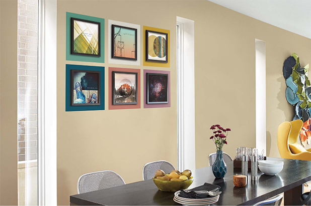 Dining room with a color-blocked accent wall with framed album colors and painted background squares in six colors.