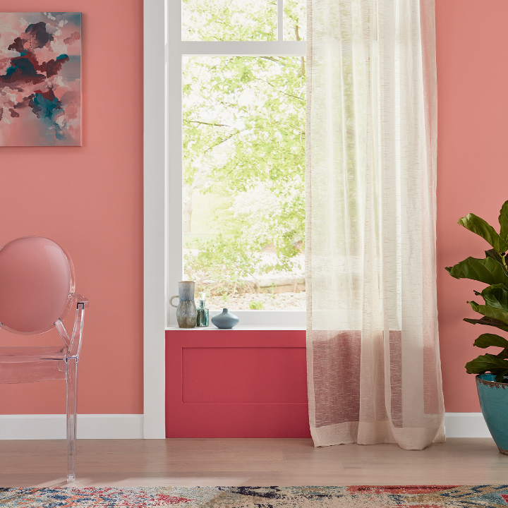 A dining room painted with the color rose window, with a close-up of a windowsill painted the color strawberry sorbet. 