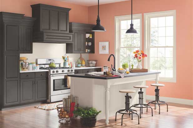 Large kitchen with an island. Backsplash painted in a light-colored semi-gloss paint.