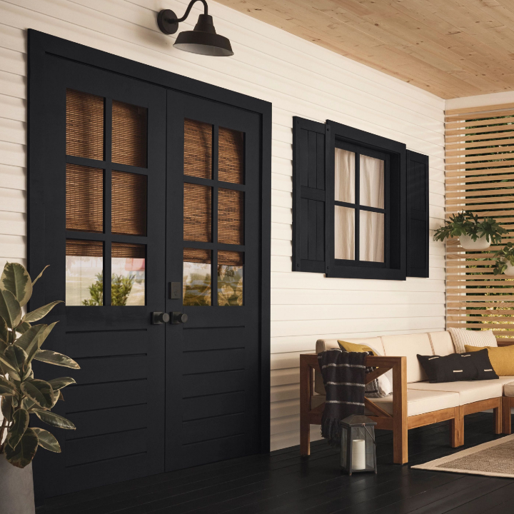 white exterior walls with black doors and window with black shutters